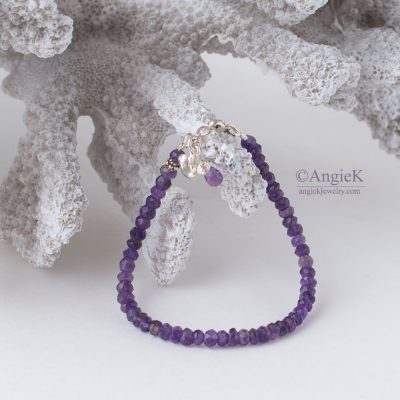 Handmade trendy Amethyst faceted gemstone charm bracetet featuring a Bird Charm and Sterling Silver clasp