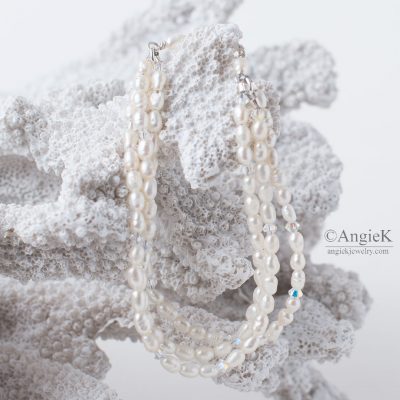 beautiful handmade multi strand Sterling Silver bracelet featuring White Rice Freshwater Pearl Crystal and  Swarovski Elements